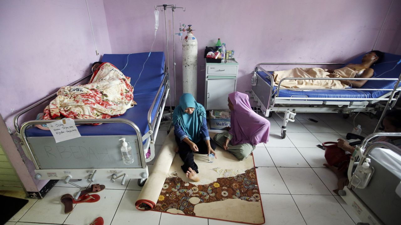 Tsunami survivors rest at a hospital in Pandeglang, Indonesia, Monday. Doctors are working to help survivors, and rescuers are looking for more victims from a deadly tsunami that smashed into beachside buildings along an Indonesian strait.