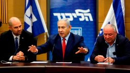 Israeli Prime Minister Benjamin Netanyahu (C) delivers a statement at the Israeli Parliament in Jerusalem, on December 24, 2018. 