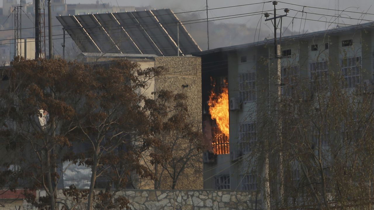 Flames rise from a government building after an explosion and attack by gunmen, in Kabul, Afghanistan, on December 24. 