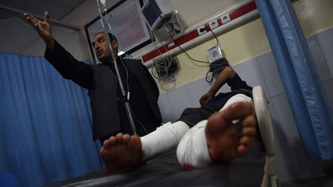 A wounded man receives treatments at the Wazir Akbar Khan Hospital after the car bomb attack in Kabul.