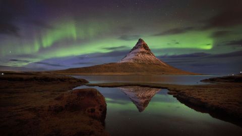 <strong>Kirkjufell, Iceland: </strong>The aurora borealis, or northern lights, are seen over Kirkjufell, a 463-meter mountain on the west coast of Iceland. 