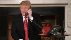 WASHINGTON, DC - DECEMBER 24: U.S. President Donald Trump takes phone calls from children as he participates in tracking Santa Claus' movements with the North American Aerospace Defense Command (NORAD) Santa Tracker on Christmas Eve in the East Room of the White House December 24, 2018 in Washington, DC. This is the 63rd straight year that NORAD has publicly tracked Santa's sleigh on its global rounds. (Photo by Chip Somodevilla/Getty Images)