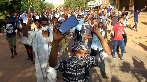 Sudanese protesters march Tuesday in Khartoum against President Omar al-Bashir's government. 