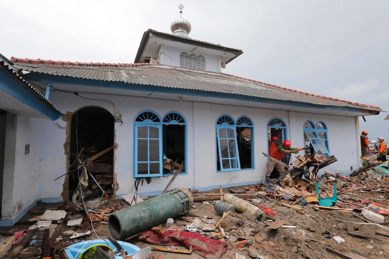 People clean up a mosque.
