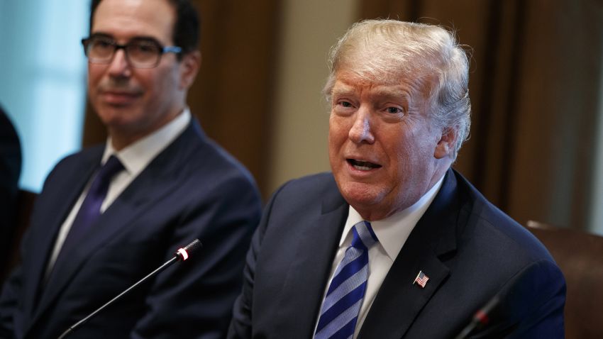 Treasury Secretary Steve Mnuchin, left, listens as President Donald Trump speaks during an expanded bilateral meeting with the Emir of Kuwait Sheikh Sabah Al Ahmad Al Sabah in the Cabinet Room of the White House, Wednesday, Sept. 5, 2018, in Washington. (AP Photo/Evan Vucci)