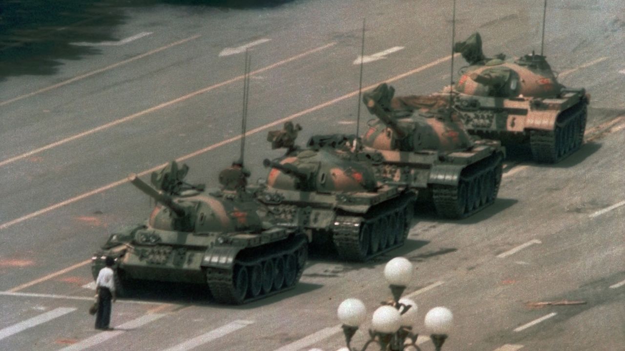 A Chinese man stands alone to block a line of tanks heading east on Beijing's Cangan Blvd. in Tiananmen Square on June 5, 1989.