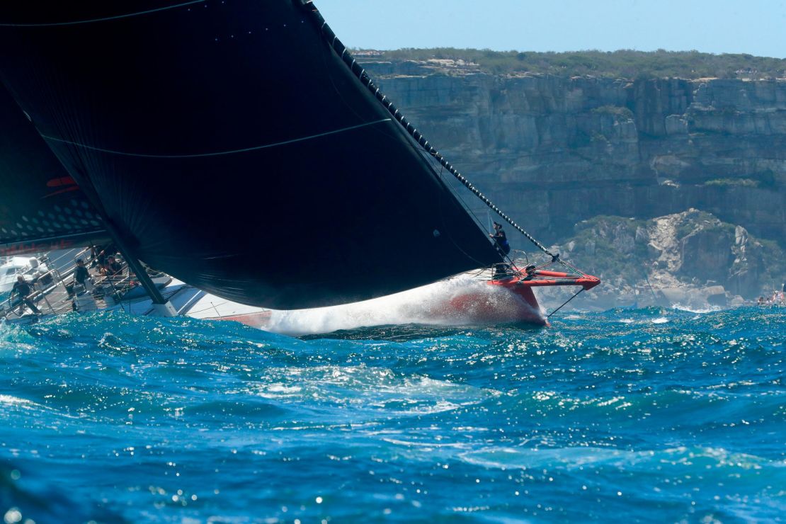 Reigning champion Comanche sails out of the Sydney Heads at the start of the 2018 Sydney Hobart yacht race. 