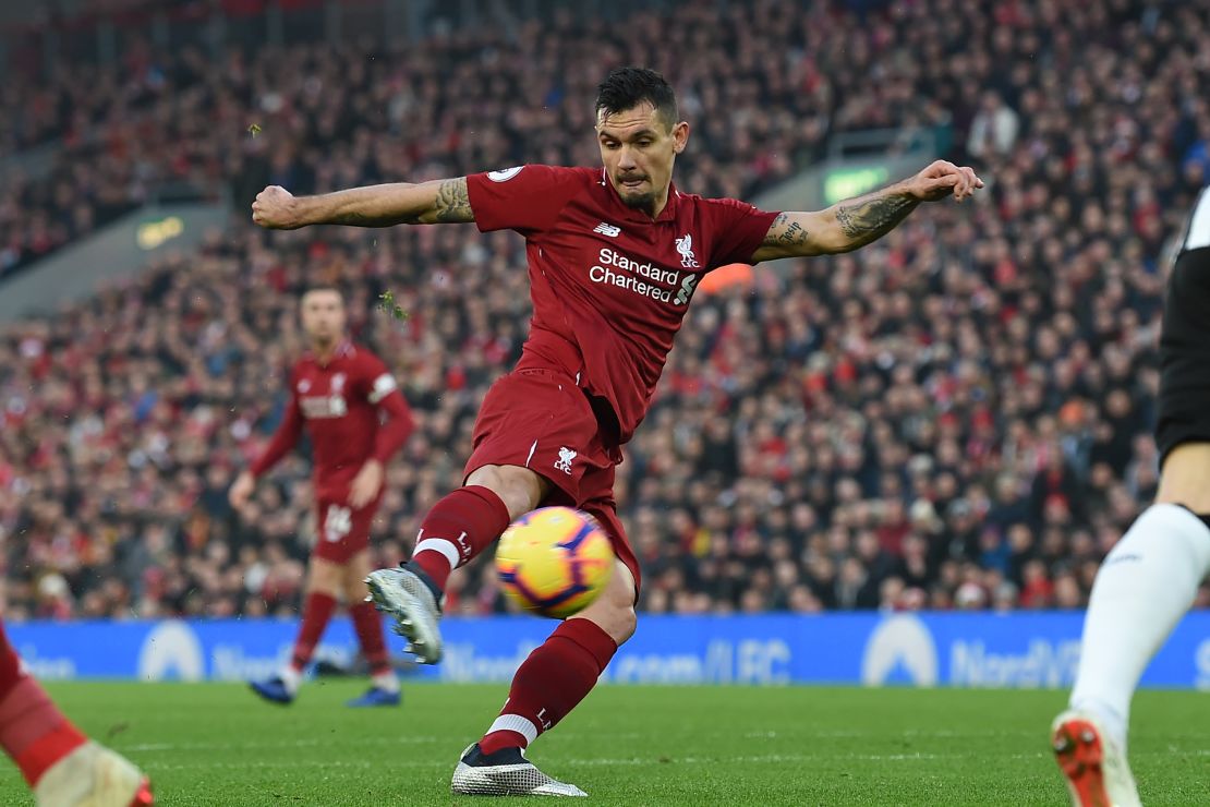 Liverpool's Croatian defender Dejan Lovren shoots to score the opening goal of the English Premier League match against  Newcastle United at Anfield.