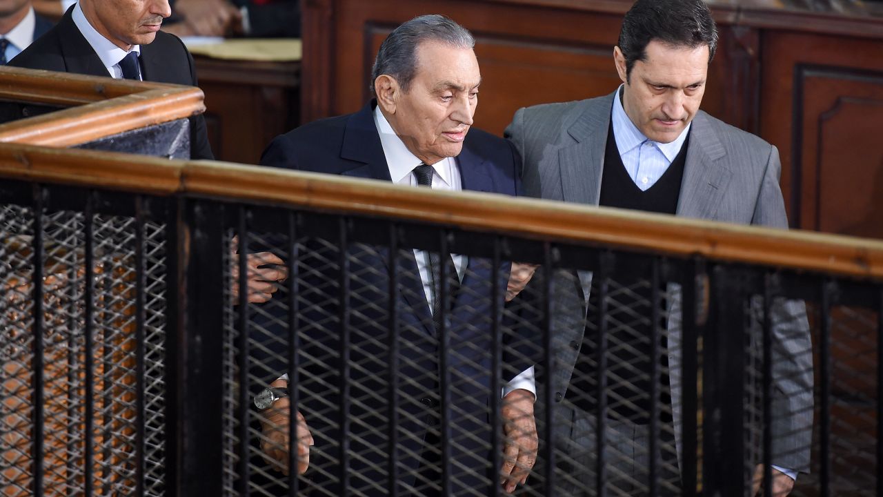 Former Egyptian president Hosni Mubarak is escorted by his two sons at the trial on December 26, 2018.