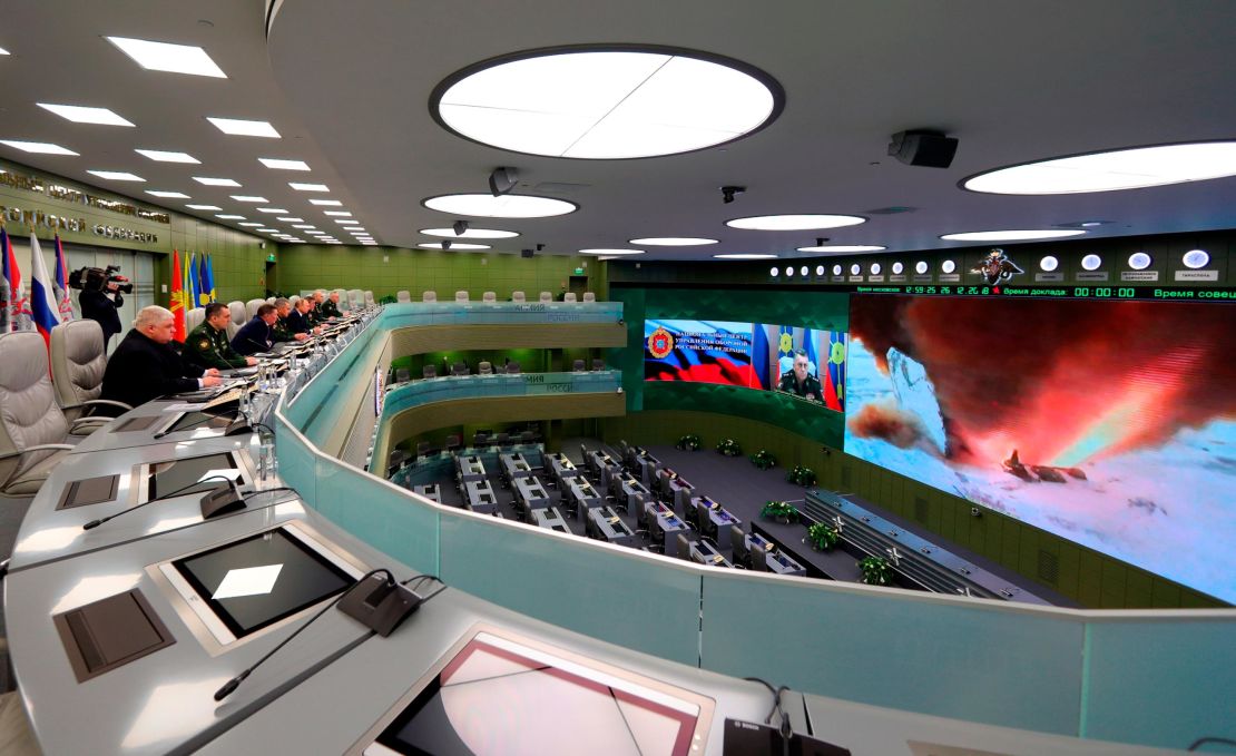 Russian Defense Minister Sergei Shoigu, fourth left, Russian President Vladimir Putin, fifth left, Chief of General Staff of Russia Valery Gerasimov, sixth left, and other top officials oversee the test launch of the Avangard hypersonic glide vehicle from the Defense Ministry's control room in Moscow on Wednesday. In the test, the Avangard was launched from the Dombarovskiy missile base in the southern Ural Mountains. The Kremlin says it successfully hit a designated practice target on the Kura shooting range on Kamchatka.