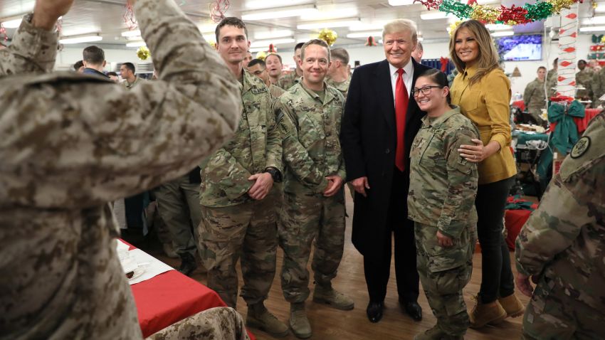 U.S. President Donald Trump and First Lady Melania Trump greet military personnel at the dining facility during an unannounced visit to Al Asad Air Base, Iraq December 26, 2018. REUTERS/Jonathan Ernst