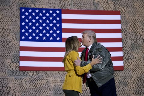 President Trump kisses the first lady during a hanger rally.