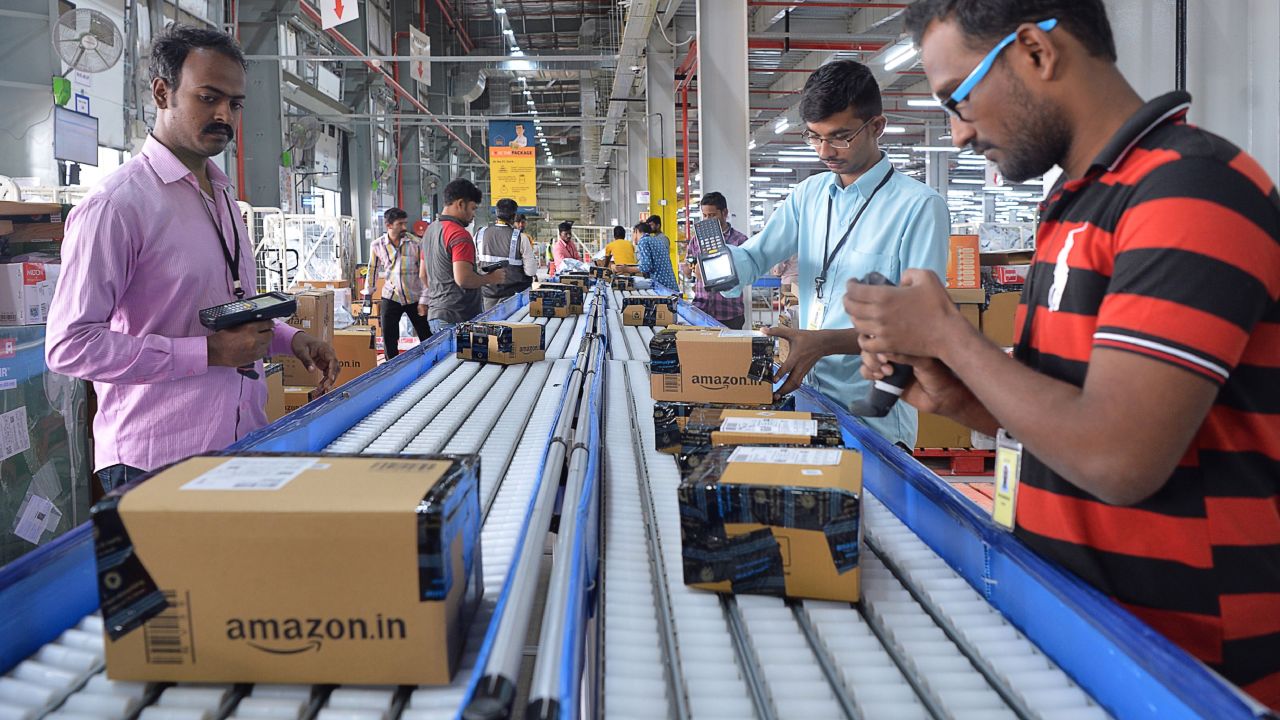 Employees of Amazon India scan packages at a new  fulfilment centre on the outskirts of Bangalore.