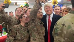 US President Donald Trump and First Lady Melania Trump greet members of the US military during an unannounced trip to Al Asad Air Base in Iraq on December 26, 2018. 