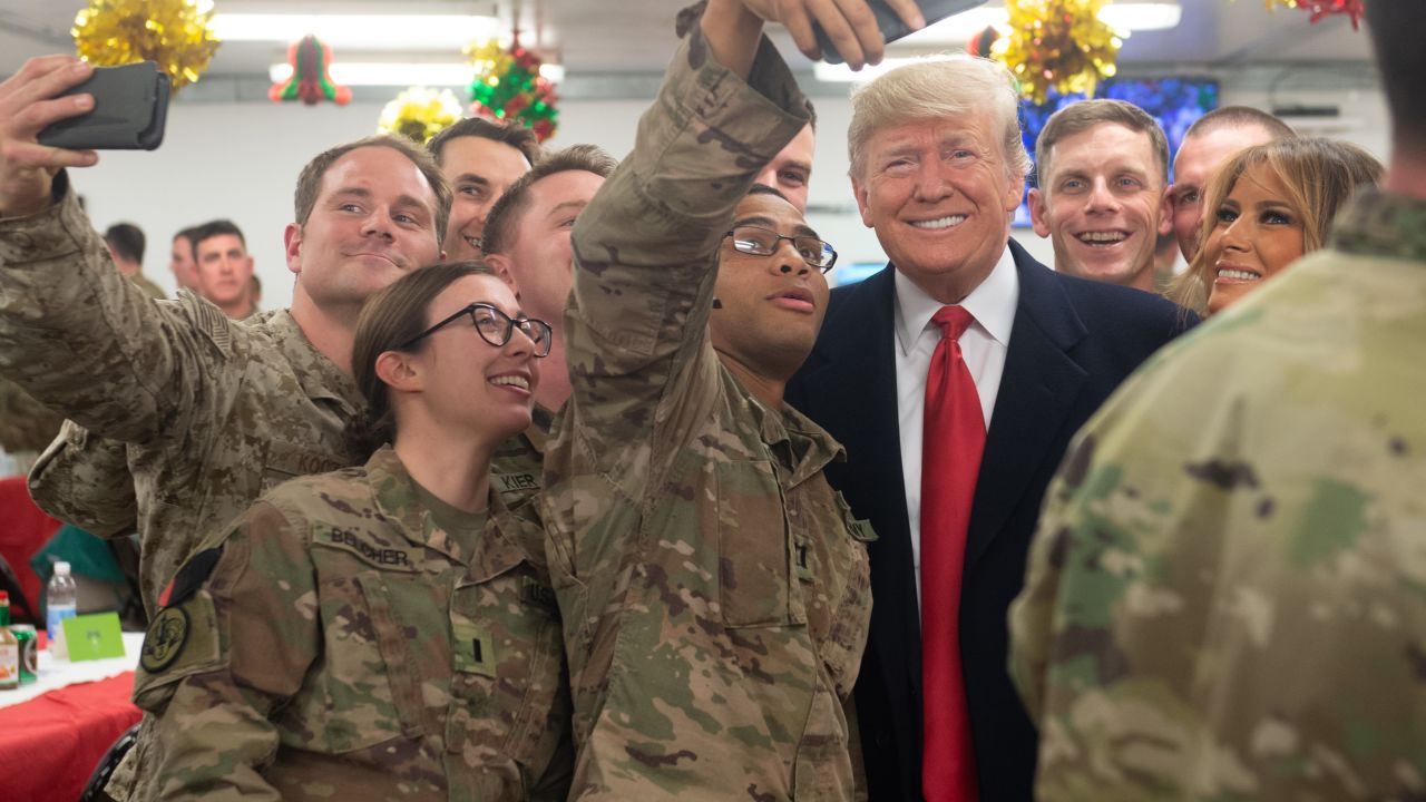 US President Donald Trump and First Lady Melania Trump greet members of the US military during an unannounced trip to Al Asad Air Base in Iraq on December 26, 2018. 