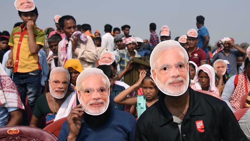 Supporters of the Bharatiya Janata Party (BJP) wearing masks of Indian Prime Minister Narendra Modi listen to Modi during an election rally at Phulbari in west Garo hills of Meghalaya on February 22, 2018.  
Assembly elections in Meghalaya and Nagaland will be held on February 28. / AFP PHOTO / Biju BORO        (Photo credit should read BIJU BORO/AFP/Getty Images)