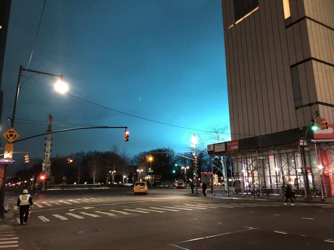 Manhattan's sky lights up in an eerie shade of blue Thursday night, as seen from Columbus Circle.