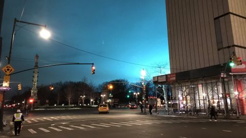 Manhattan's sky lights up in an eerie shade of blue Thursday night, as seen from Columbus Circle.