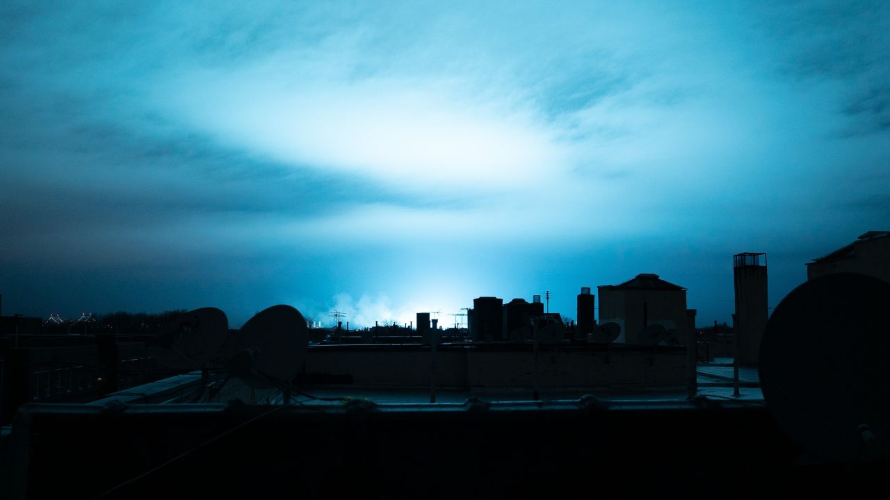 Blue light illuminates the night sky Thursday, December 27, in New York as a result of an electrical flash at a Con Edison substation in Queens.