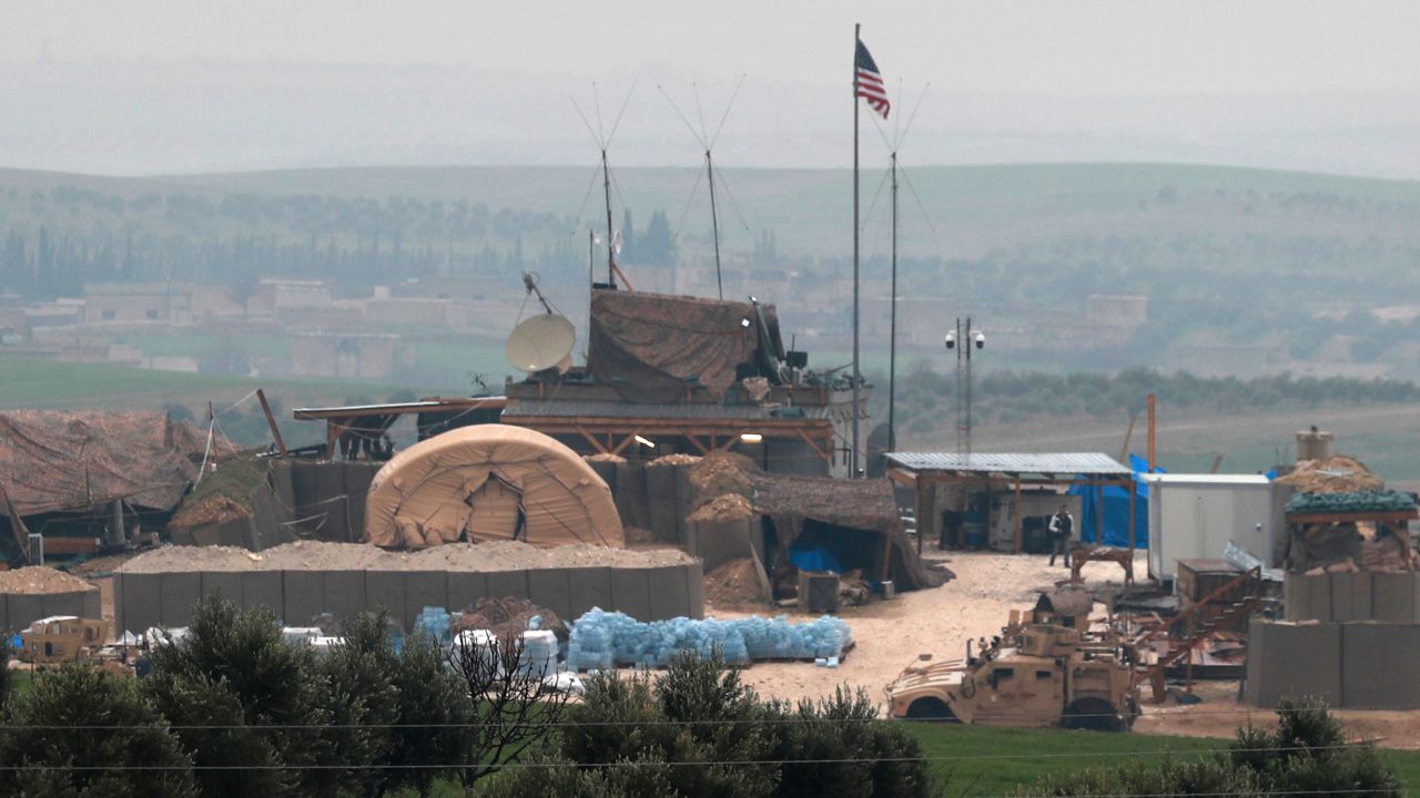 US forces' vehicles and structures are seen on the outskirts of the northern Syrian town of Manbij in the village of Dadat.