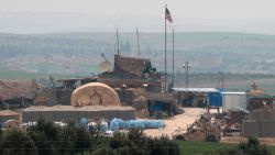 US forces' vehicles and structures are seen on the outskirts of the northern Syrian town of Manbij in the village of Dadat, on the demarcation line separating pro-Turkish factions and opposing US-backed Syrian Kurdish fighters, on December 26, 2018. - Pro-Turkish armed groups have reinforced their presence on the outskirts of the city of Manbij in northern Syria as Ankara threatens a new offensive against Kurdish forces. The United States has backed Kurdish fighters in northern Syria as part of an international coalition against the Islamic State jihadist group. But a surprise announcement by US President Donald Trump a week ago that he will pull American troops out of the country has left the Kurds exposed to attack. (Photo by Delil souleiman / AFP)        (Photo credit should read DELIL SOULEIMAN/AFP/Getty Images)