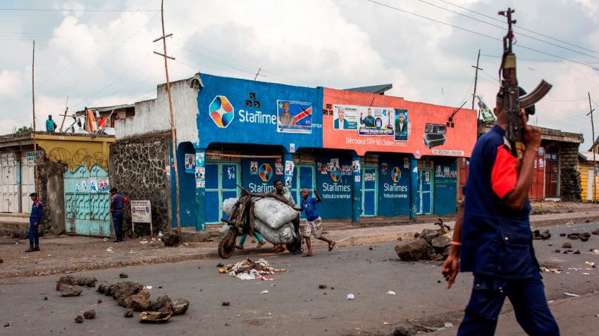 TOPSHOT - Congolese National Police patrol the street on December 28, 2018 at Majengo in Goma, in North Kivu province. - One of the world's powder-keg countries faces a crunch test on December 30 when Democratic Republic of Congo heads into elections marred by delays, clashes and fears of polling-day chaos as electoral authorities have postponed the vote until March in Beni and Butembo in North Kivu province (eastern RDCongo), and in Yumbi (western RDCongo). (Photo by PATRICK MEINHARDT / AFP)        (Photo credit should read PATRICK MEINHARDT/AFP/Getty Images)