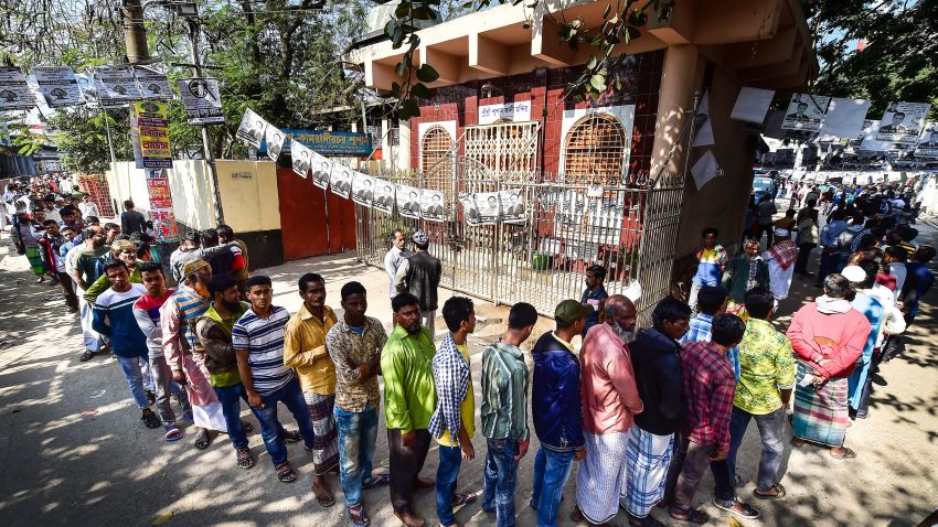 Bangladeshi voters wait in line outside a polling station in Dhaka on December 30, 2018. - Bangladesh headed to the polls on December 30 following a weeks-long campaign that was dominated by deadly violence and allegations of a crackdown on thousands of opposition activists. (Photo by Munir UZ ZAMAN / AFP)        (Photo credit should read MUNIR UZ ZAMAN/AFP/Getty Images)