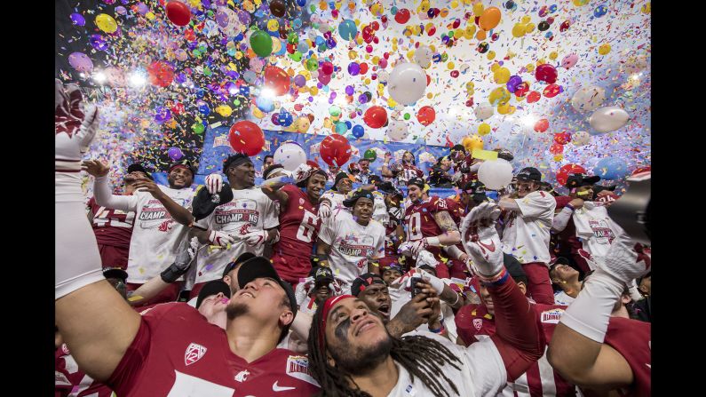 The Washington State Cougars celebrate a victory after the Alamo Bowl NCAA football game against the Iowa State Cyclones on Friday, December 28, in San Antonio. Washington State won the game 28-26.