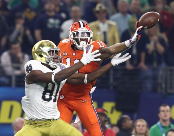 Clemson Tigers safety Isaiah Simmons, right, intercepts a pass intended for Notre Dame Fighting Irish wide receiver Miles Boykin in the first half of<a  target="_blank" target="_blank"> the Cotton Bowl</a> on Saturday, December 29, in Arlington, Texas. 