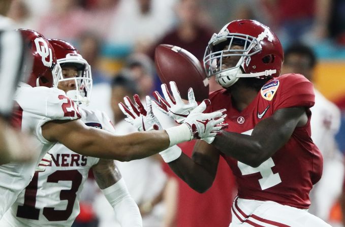 Alabama's Jerry Jeudy, right, makes the catch against Oklahoma's Tre Norwood, in the second quarter of <a href="index.php?page=&url=https%3A%2F%2Fbleacherreport.com%2Farticles%2F2812669-orange-bowl-2018-highlights-and-comments-from-alabama-vs-oklahoma" target="_blank" target="_blank">the Orange Bowl</a> on December 29, in Miami.