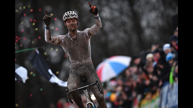 Netherlands' Mathieu van der Poel celebrates as he crosses the finish line to win the men's elite race of the cyclocross World Cup on December 23 in Namur, Belgium. 