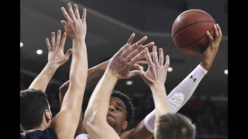 Auburn forward Chuma Okeke battles through North Florida defenders during the second half of an NCAA basketball game on December 29 in Auburn, Alabama.