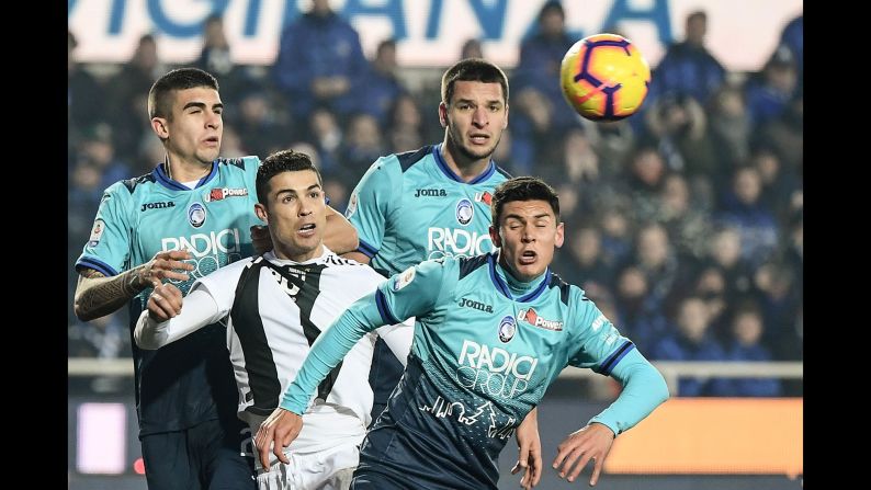 Juventus' forward Cristiano Ronaldo, second from left, eyes the ball during a game against Atalanta Bergamo on Wednesday, December 26, in Bergamo, Italy. 