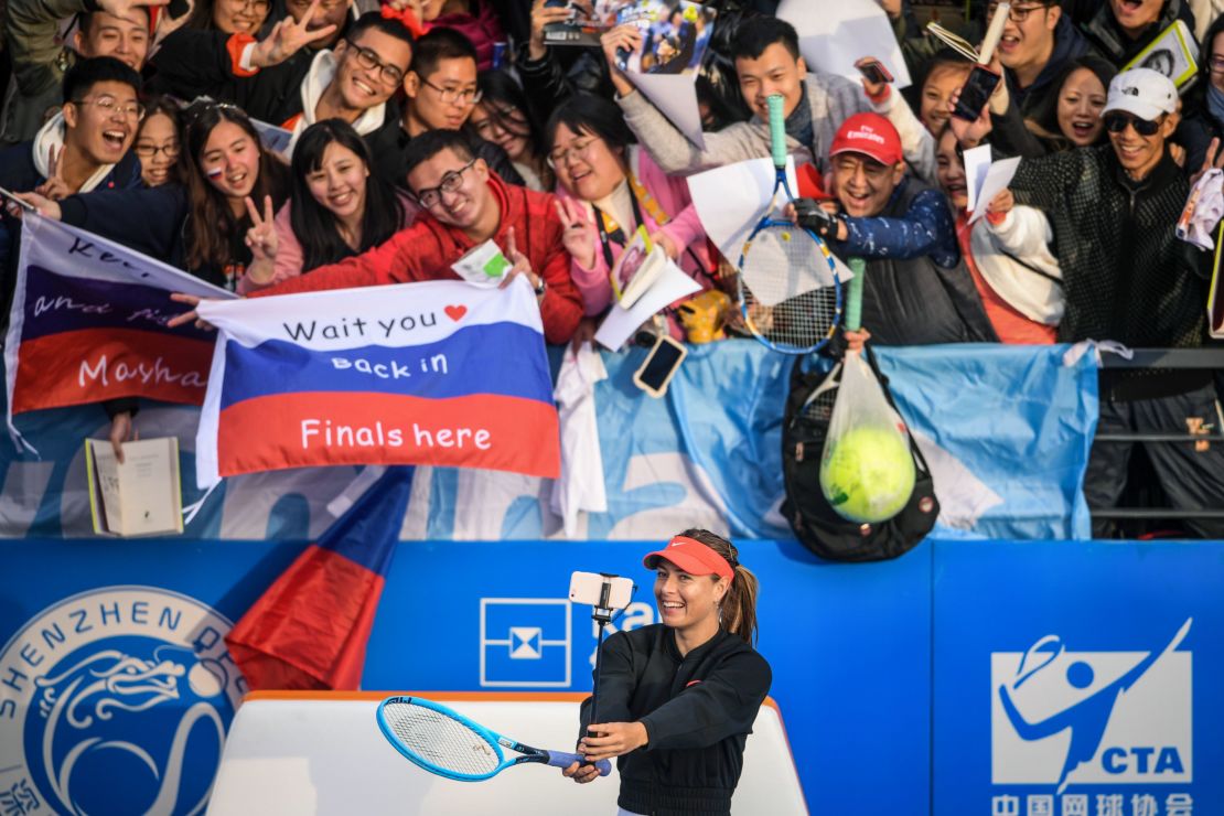 Maria Sharapova takes a selfie with fans after beating Timea Bacsinszky of Switzerland at the Shenzhen Open tennis tournament in China.