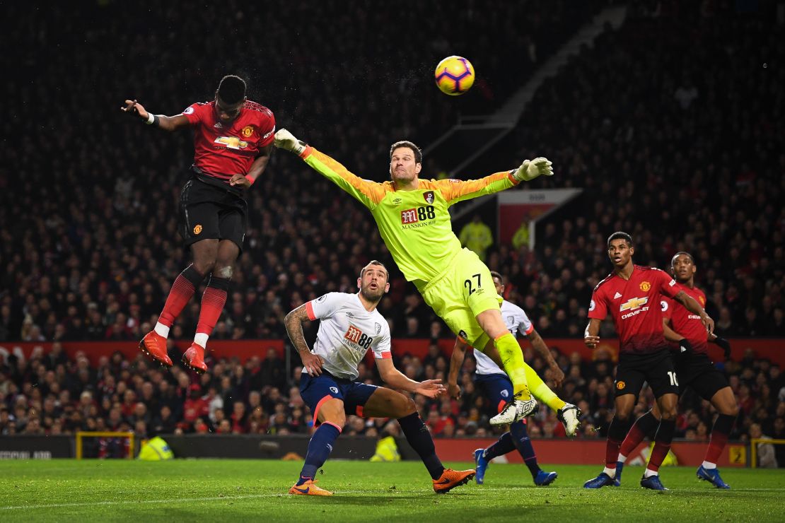 Manchester United's Paul Pogba beats Asmir Begovic of AFC Bournemouth as he scores the Red Devils' second goal.
