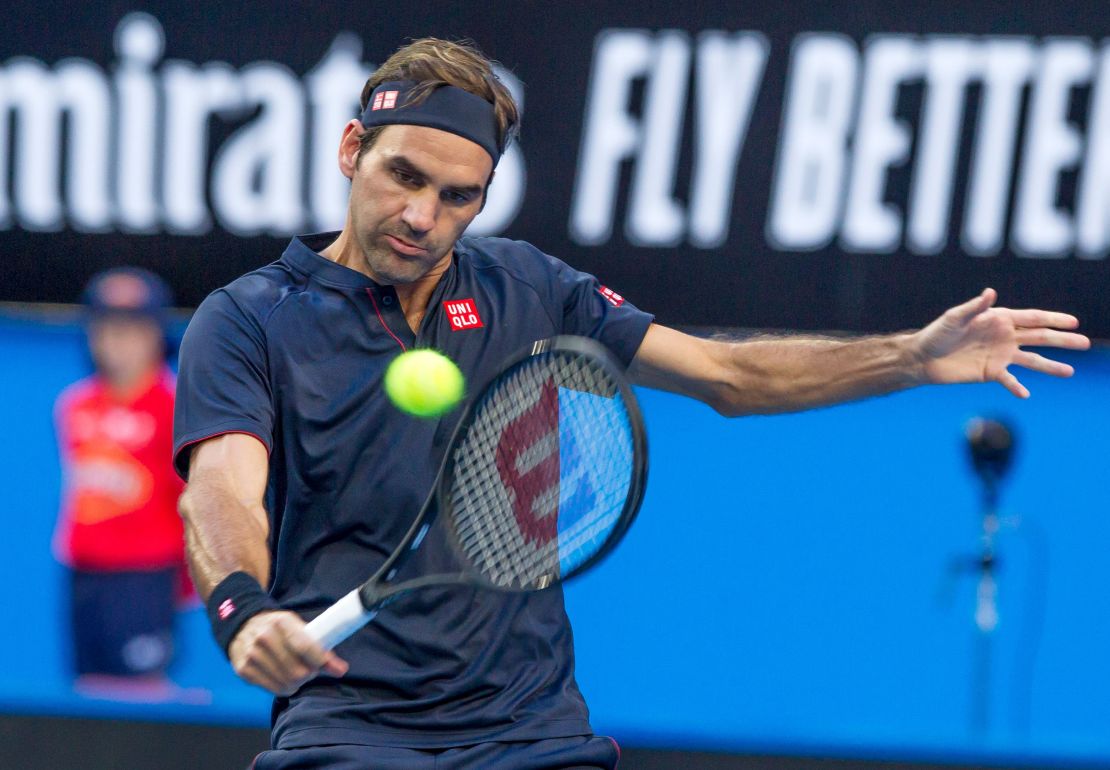 Switzerland's Roger Federer hits a return against Cameron Norrie of Britain during their men's singles match on day two of the Hopman Cup.