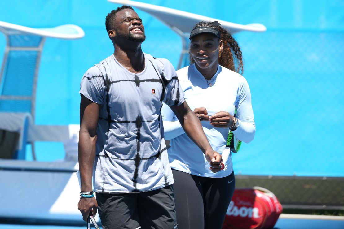 US' Frances Tiafoe and Serena Williams share a moment on the practice court during day two.