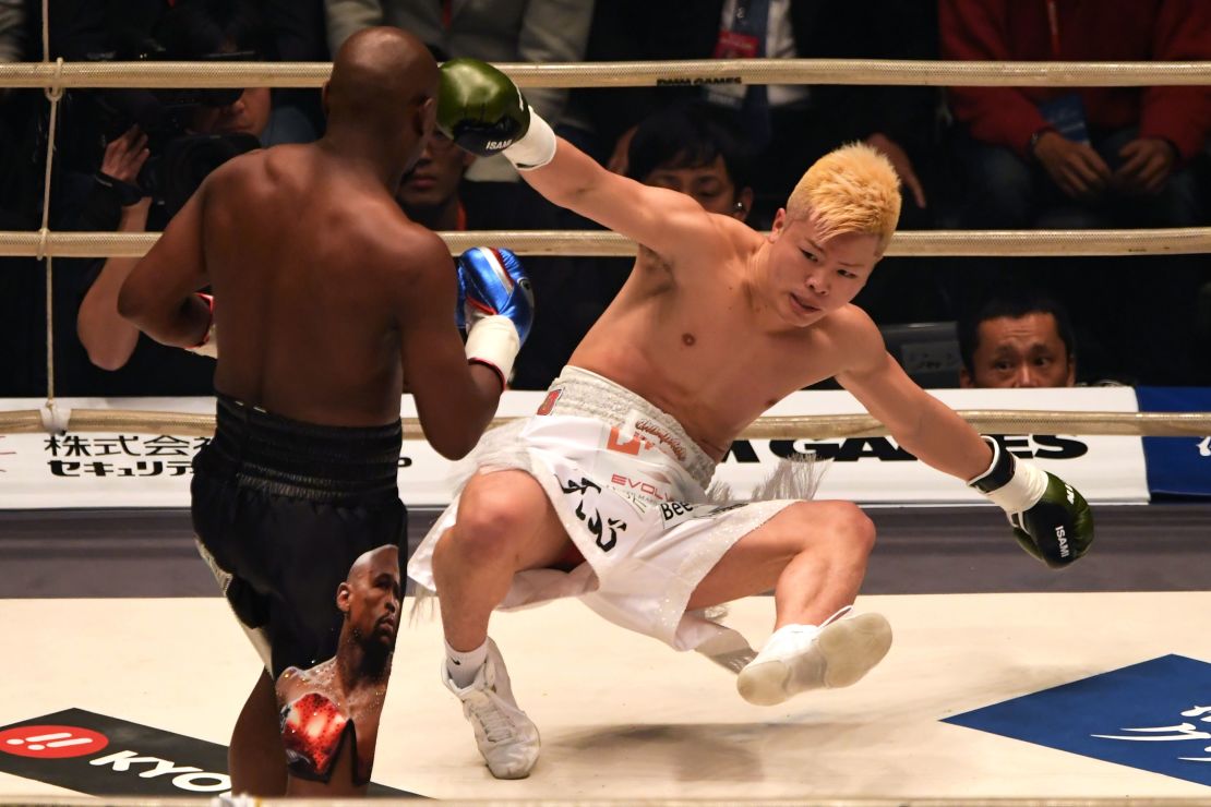 US boxing legend Floyd Mayweather Jr  knocks down Japanese opponent Tenshin Nasukawa in their exhibition bout in Saitama on New Year's Eve.