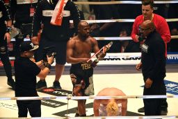 Floyd Mayweather holds the trophy aloft after beating his youthful opponent Tenshin Nasukawa at the Saitama Super Arena in Japan.