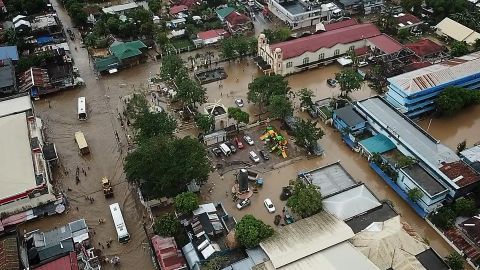 An aerial photograph shows flooding in the town of Baao in Camarines Sur province on December 30.