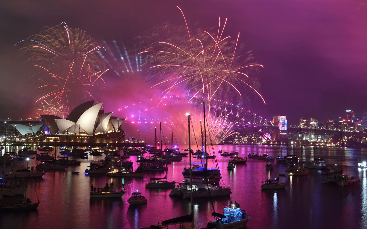 Fireworks explode over the Harbour Bridge and Opera House in Sydney.