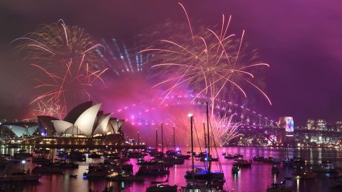 Fireworks explode over the Harbour Bridge and Opera House in Sydney.