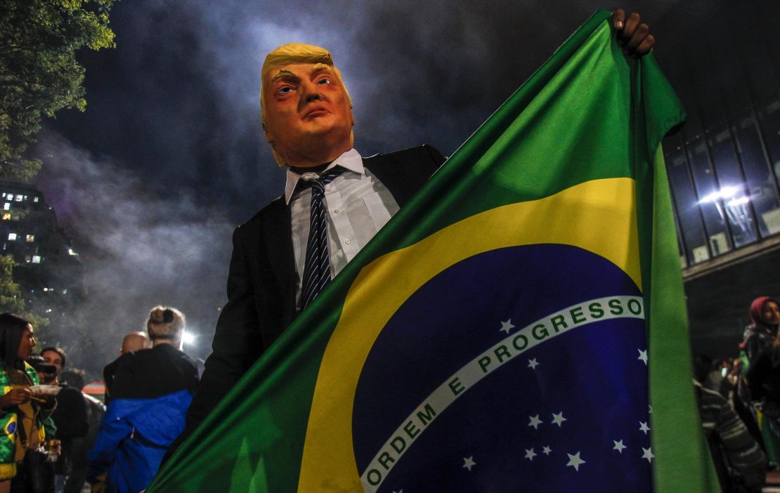 A Bolsonaro supporter in a Trump mask celebrates in the wake of October's election.
