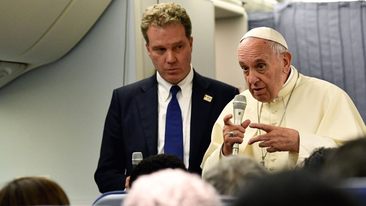 The Pope, flanked by Greg Burke, answers questions from journalists in January 2018.