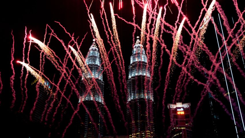 Fireworks explode in front of Malaysia's landmark building, the Petronas Twin Towers, during the New Year's celebration in Kuala Lumpur, Malaysia, Tuesday, Jan. 1, 2019.(AP Photo/Yam G-Jun)