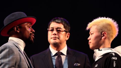 US boxing legend Floyd Mayweather Jr and kickboxer Tenshin Nasukawa of Japan pose on the stage during a weigh-in event at Saitama Super Arena.