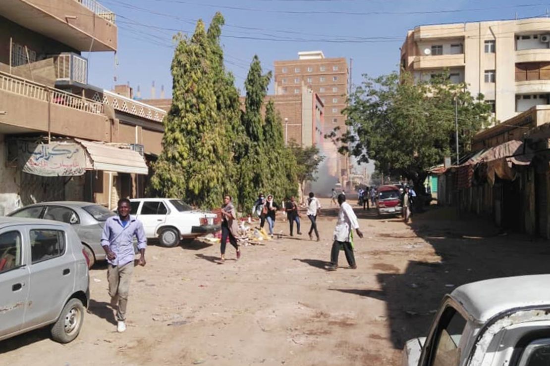 Sudanese protesters run away from tear gas during a demonstration in Khartoum on Monday. 