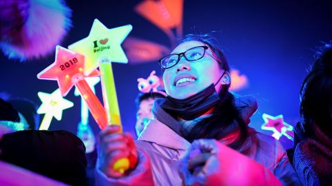 A woman waits to celebrate 2019 during the countdown in front of Beijing's National Stadium.