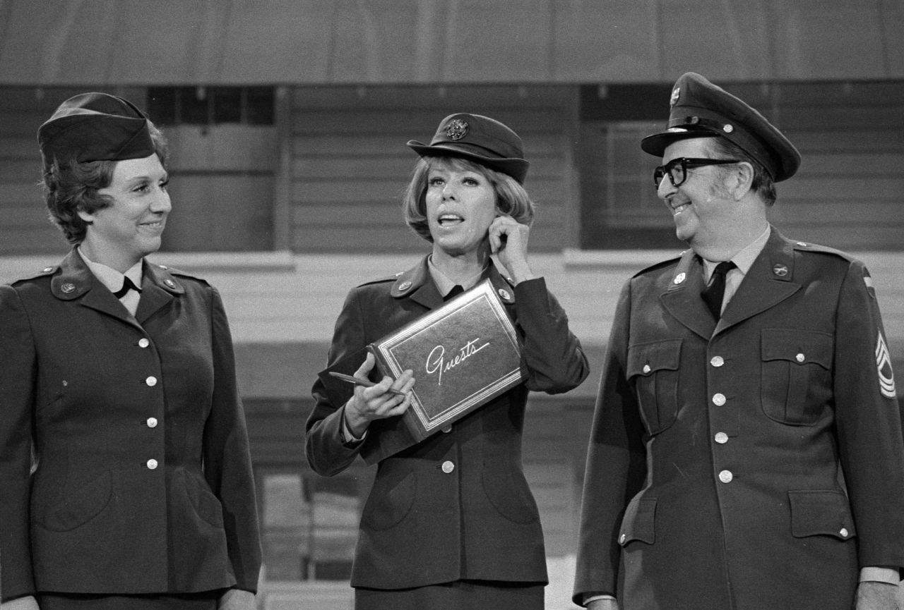 Burnett — flanked by Jean Stapleton and Phil Silvers — tugs on her ear during an episode of "The Carol Burnett Show" in 1975. Burnett's signature ear tug came at the end of each episode and was her way of saying hello to her grandmother who raised her.