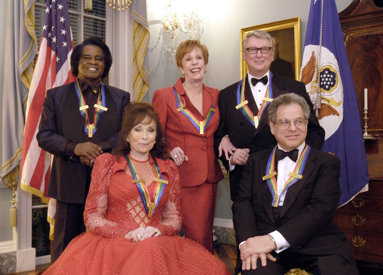 Burnett, center, poses with other Kennedy Center honorees in 2003. Joining her, from left, are singer James Brown, singer Loretta Lynn, film director Mike Nichols and violinist Itzhak Perlman.